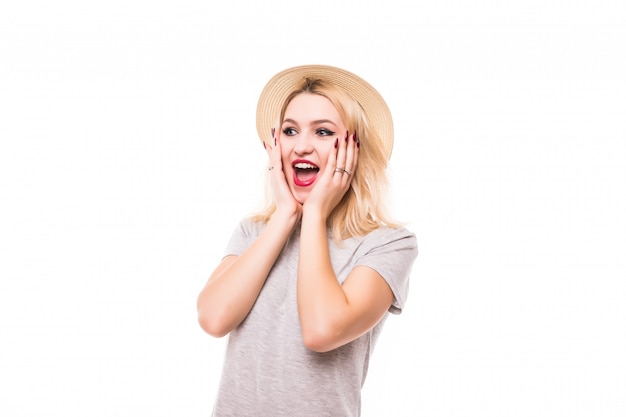 Happy Young Beautiful Woman Surprised isolated on white wall