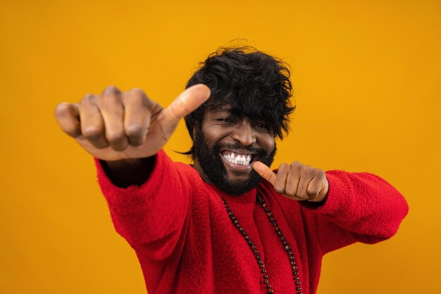 Happy young black man giving thumbs up