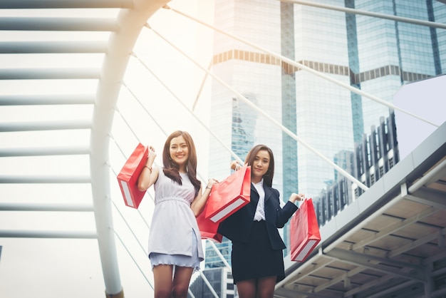 Happy young Business Woman holding shopping bags.