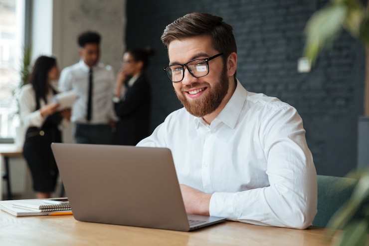 Free Photo happy young caucasian businessman
