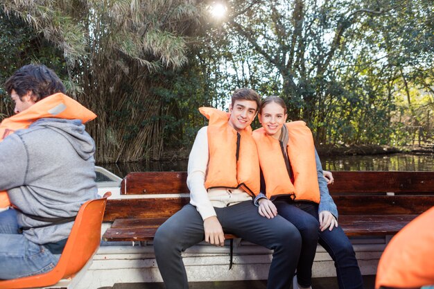 Happy young couple on a boat