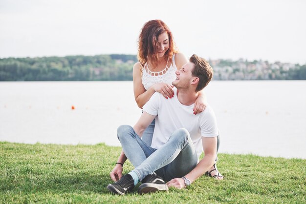 Happy young couple enjoying a solitary beach backriding