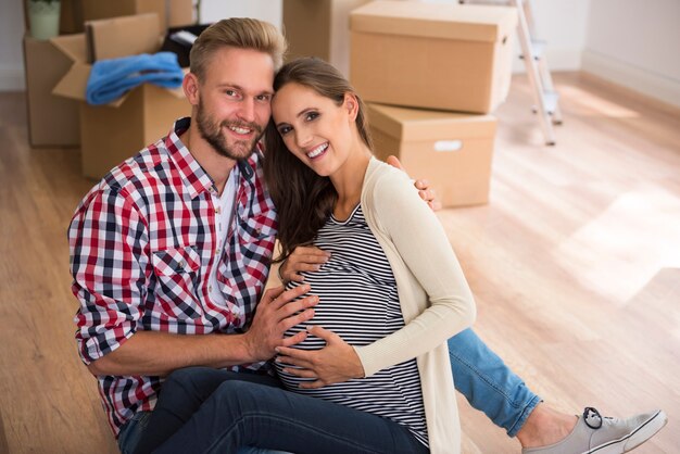 Happy young couple expecting their first child