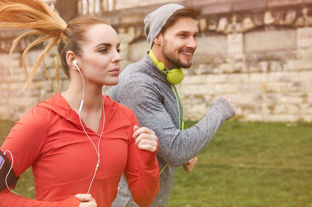 happy young couple running outdoors