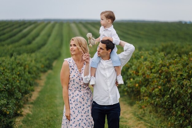 Happy Young Family Dad,mom and little  son looks happy in the park