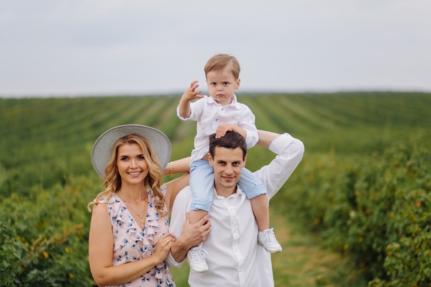 Happy Young Family Dad,mom and little  son looks happy in the park