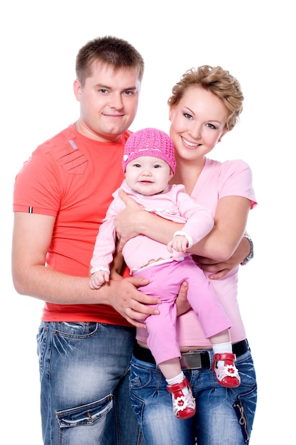 Happy young family with beautiful baby on 