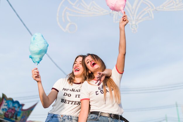 Happy young friends in the amusement park