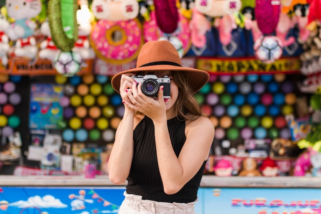 Happy young girl in the amusement park