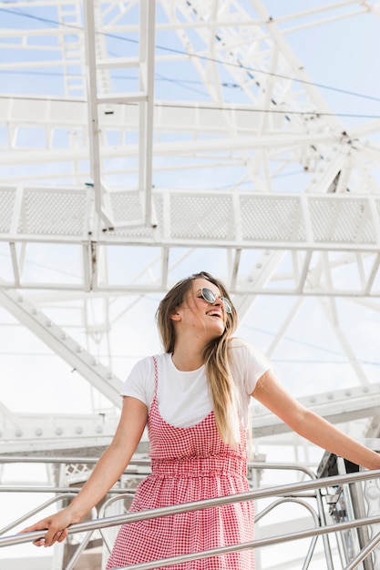 Happy young girl in the amusement park