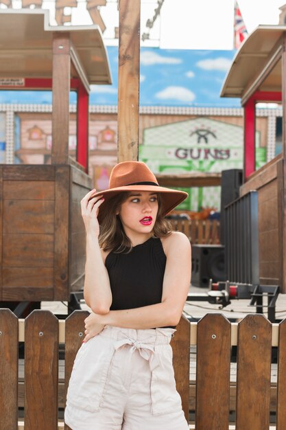 Happy young girl in the amusement park