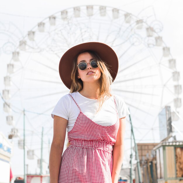 Happy young girl in the amusement park