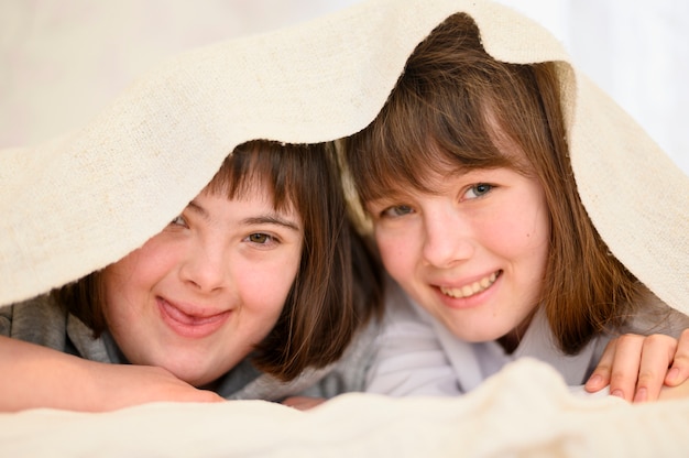 Free photo happy young girls posing together