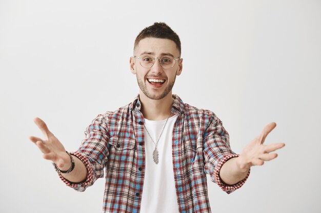 Happy young guy with glasses posing