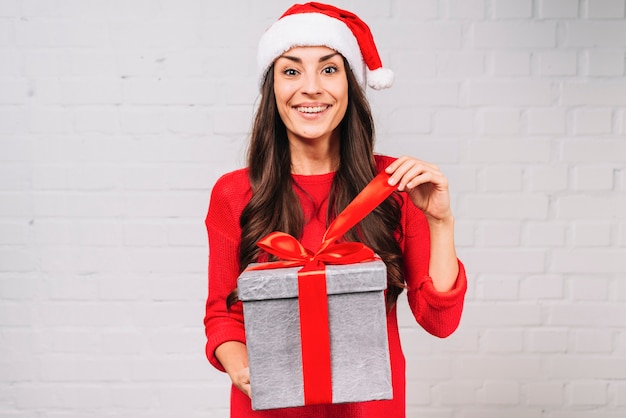 Free photo happy young lady with present box