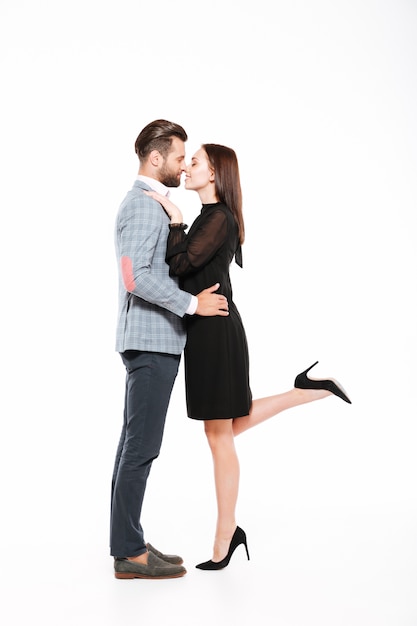 Happy young loving couple hugging isolated