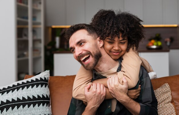 Happy young man embraced by beautiful woman