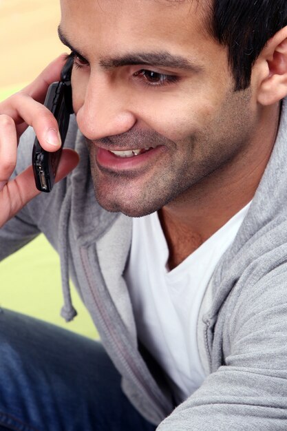 Happy and young man on white