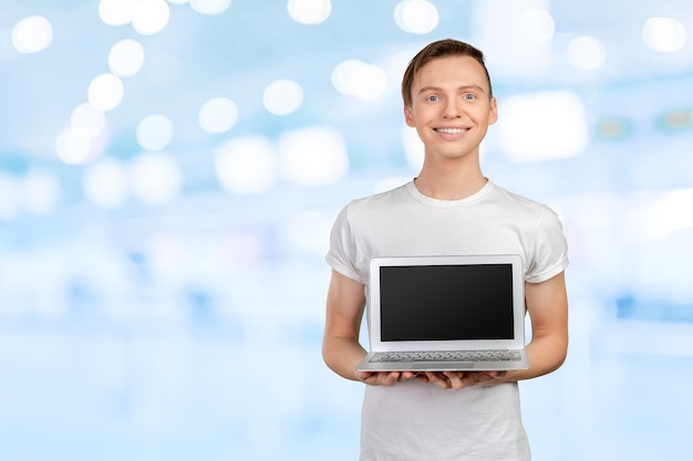 Happy young man with laptop