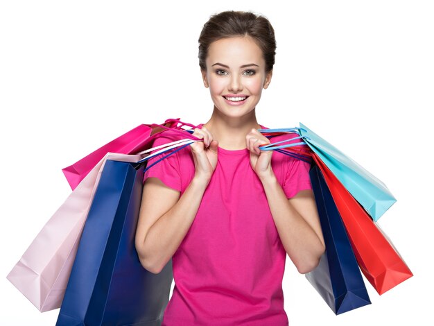 Happy young smiling woman with shopping bags after shopping