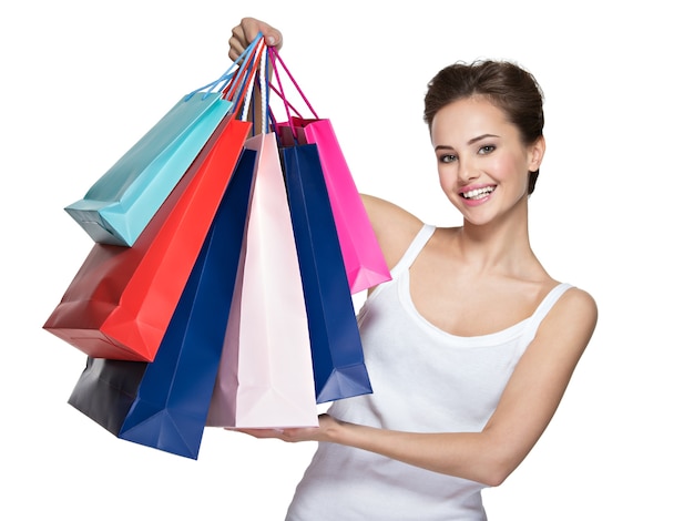 Happy young smiling woman with shopping bags after shopping