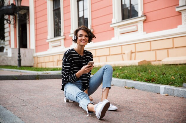 Happy young teenage girl with headphones