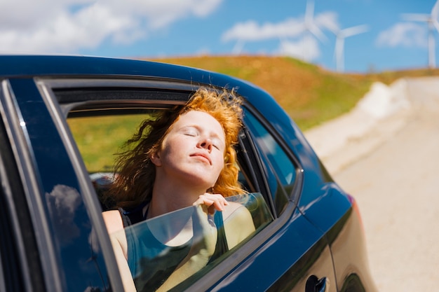 Free photo happy young woman enjoying ride