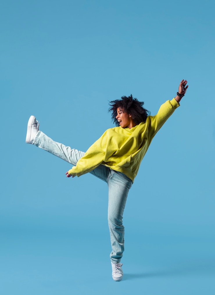 Free Photo happy young woman jumping
