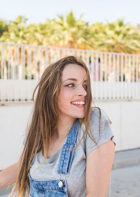 Happy young woman looking away