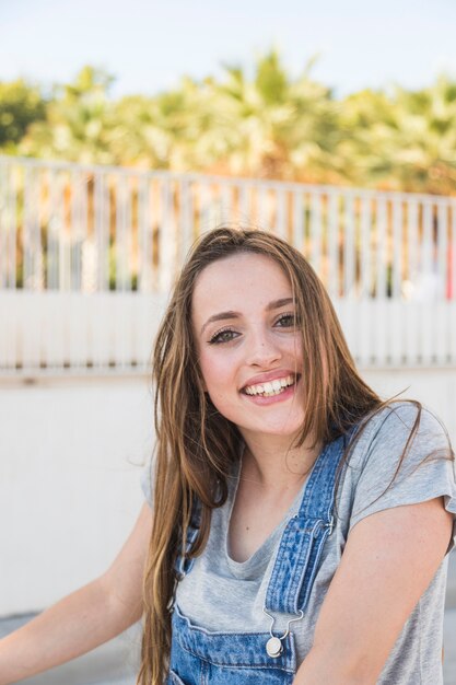 Happy young woman at outdoors