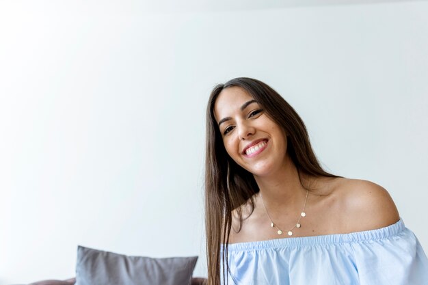 Happy young woman posing