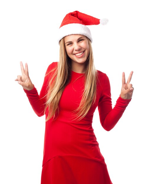 Happy young woman showing victory gestures