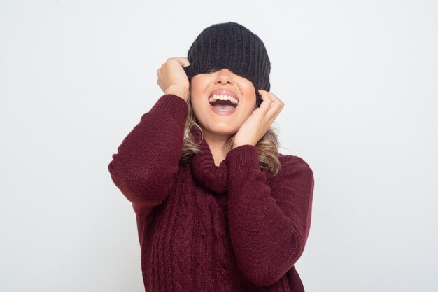 Happy young woman wearing hat