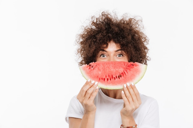 Happy young woman with curly hair