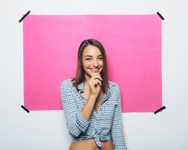 Happy young woman with lollipop