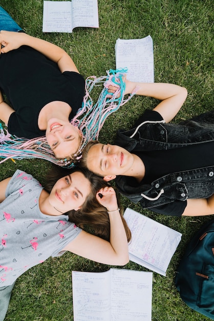 Free photo happy youngsters posing on grass