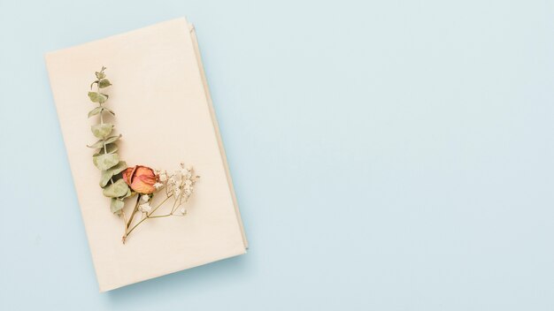 Hardcover open book with flowers