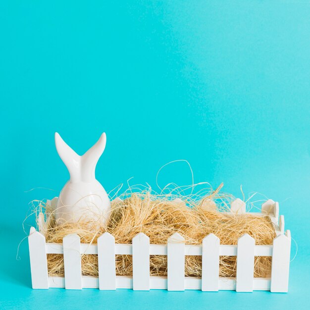 Hare figurine in hay