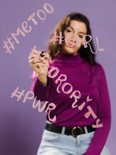 Free photo hashtags words written on a transparent glass by woman