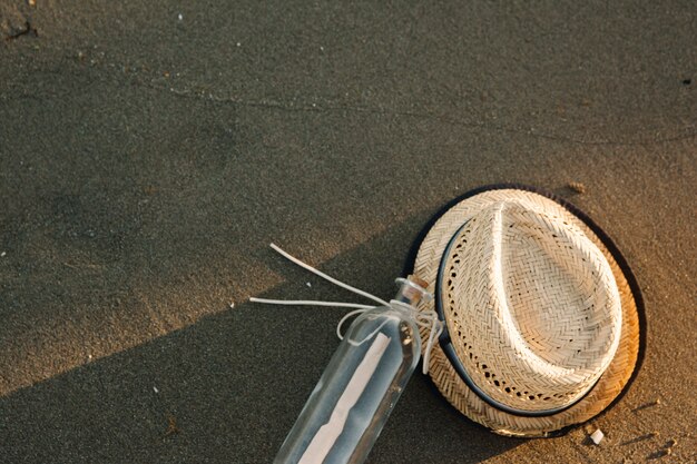 Hat and bottle at the beach