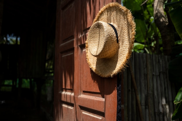 Free photo hat hanging on doorknob outdoors