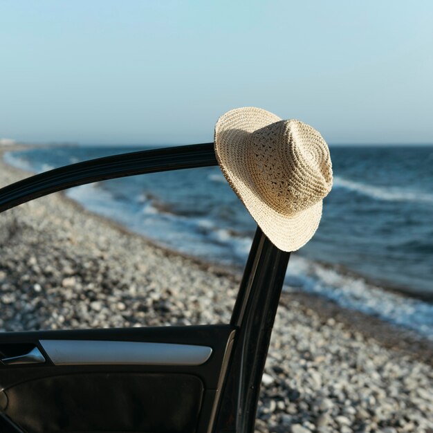 Hat hanging off car door