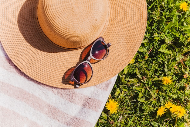 Hat and sunglasses on top view