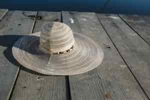 Free photo hat on a wooden surface