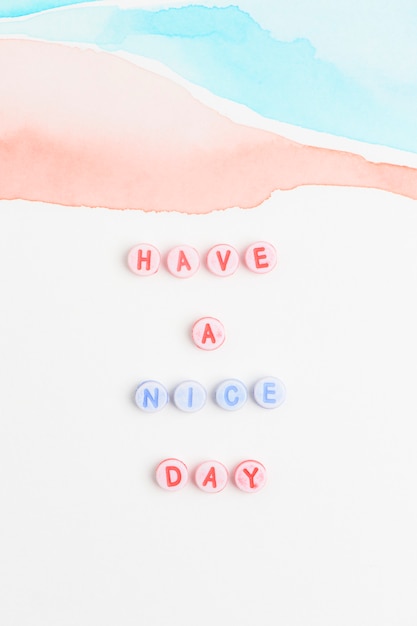 Have a nice day beads text typography on pastel Free Photo