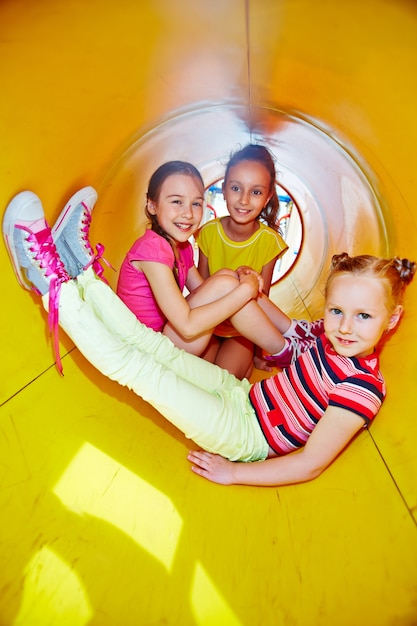 Having a good time in the yellow slide