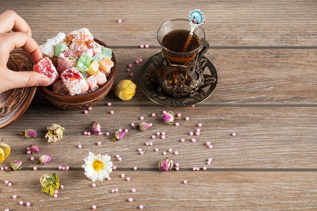 Having lokum candies with a glass of tea