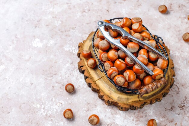 Hazelnuts on concrete background, top view