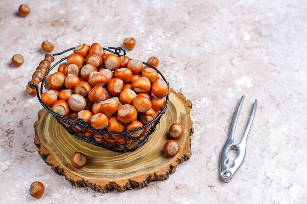 Hazelnuts on concrete background, top view