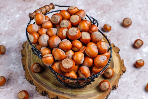 Hazelnuts on concrete background, top view